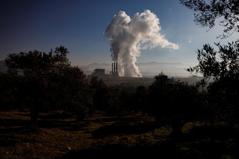 Smoke rises from Yatagan thermal power plant, in Mugla province, Turkey. Five villages have disappeared as mines serving the power station have expanded, and Turgut is now threatened. Reuters