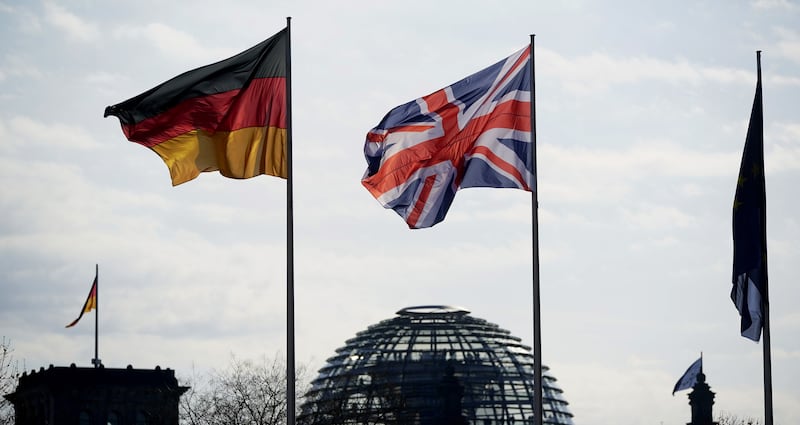 The national flags of Germany and Britain wave over the  Bundestag in Berlin. EPA