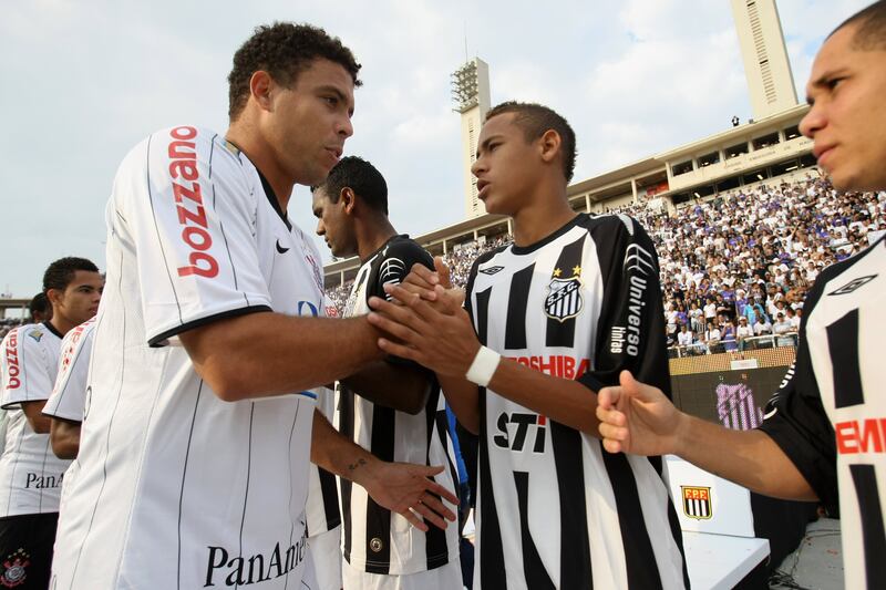 Brazil legend Ronaldo, left, of Corinthians, greets Neymar, of Santos, before the 2009 Paulista Championship fixture in May 2009. AFP