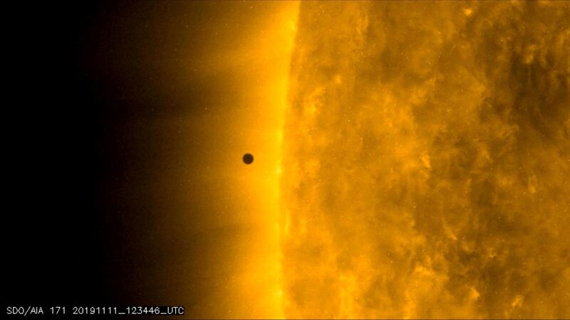 This still image from video issued by NASA's Solar Dynamics Observatory shows Mercury as it passes between Earth and the sun.  AP