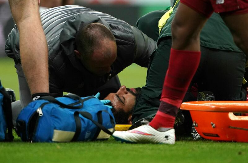 Salah receives treatment after sustaining an injury. Owen Humphreys / AP Photo