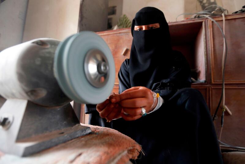 Safa al-Faqih crafts a stone in the old city of the capital, Sanaa, on April 18, 2018. Mohammed Huwais / AFP Photo