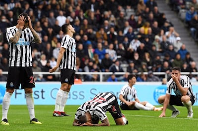 NEWCASTLE UPON TYNE, ENGLAND - AUGUST 26:  Deandre Yedlin of Newcastle United and his teammates look dejected as Deandre Yedlin of Newcastle United scores an own goal, Chelsea's second goal during the Premier League match between Newcastle United and Chelsea FC at St. James Park on August 26, 2018 in Newcastle upon Tyne, United Kingdom.  (Photo by Stu Forster/Getty Images) ***BESTPIX***