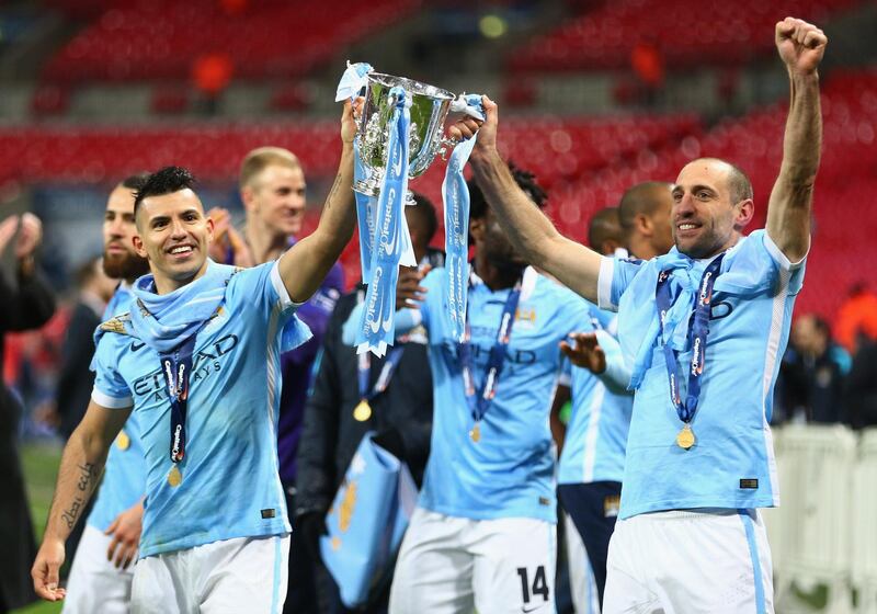 LONDON, ENGLAND - FEBRUARY 28:  Sergio Aguero of Manchester City and team mate Pablo Zabaleta celebrate victory with the trophy after the Capital One Cup Final match between Liverpool and Manchester City at Wembley Stadium on February 28, 2016 in London, England. Manchester City win 3-1 on penalties.  (Photo by Clive Brunskill/Getty Images)