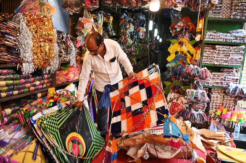 A vendor arranges kites at a shop in Hyderabad. AFP