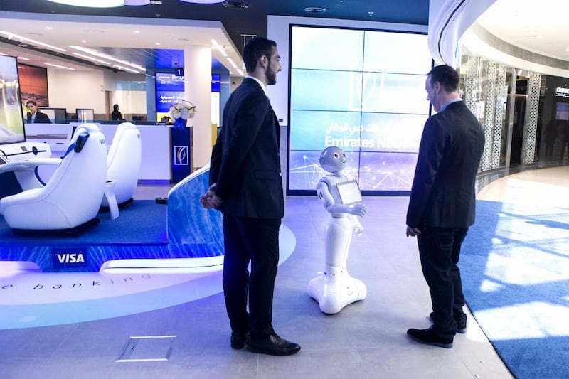 Emirates NBD’s robot assistant, Pepper, greets visitors at the Emirates NBD Future Lab in Dubai. Reem Mohammed / The National