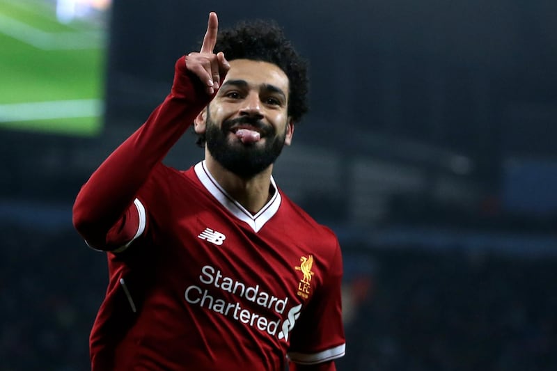 epa06660220 Liverpool's Mohamed Salah celebrates after scoring the 1-1 equalizer during the UEFA Champions League quarter final second leg match between Manchester City and FC Liverpool in Manchester, Britain, 10 April 2018.  EPA/Nigel Roddis