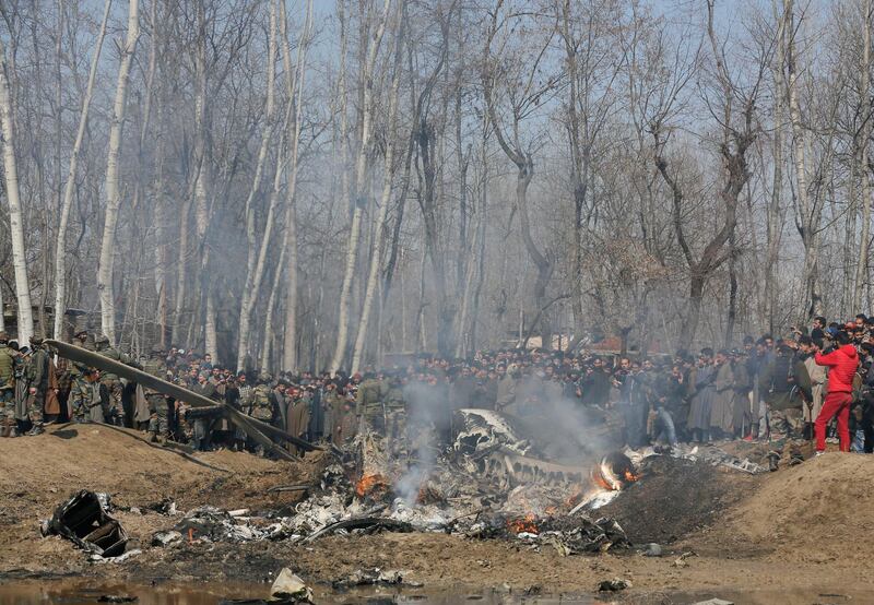 Kashmiri villagers gather near the wreckage of an Indian aircraft after it crashed in the Budgam area on the outskirts of Srinagar. AP Photo