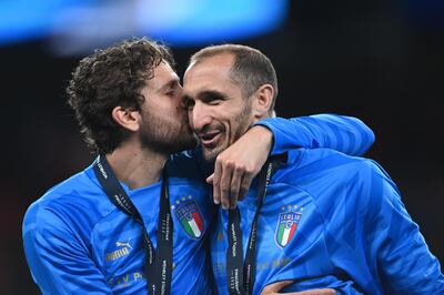 Italy's Manuel Locatelli kisses teammate Giorgio Chiellini after the defender's final game for his country. EPA