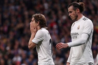Real Madrid's Luka Modric, left, and Gareth Bale, right, have struggled to step up to score the goals to replace Cristiano Ronaldo's presence in the side. Reuters 