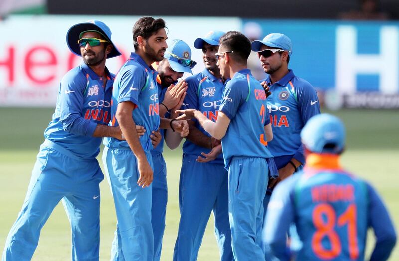 DUBAI , UNITED ARAB EMIRATES, September 19 , 2018 :- Bhuvneshwar Kumar ( 2nd left ) of India celebrating after taking the wicket of Imam ul Haq during the Asia Cup UAE 2018 cricket match between Pakistan vs India held at Dubai International Cricket Stadium in Dubai. ( Pawan Singh / The National )  For Sports. Story by Paul 