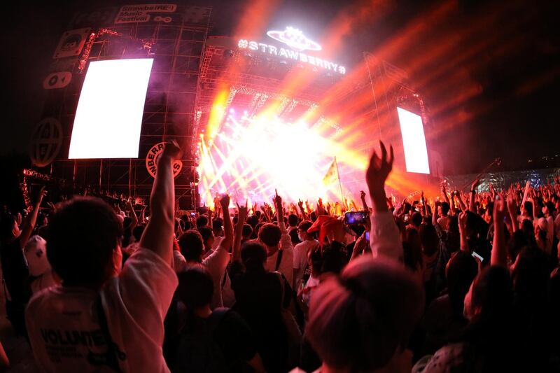 Fans attend a performance of a rock band at the Strawberry Music Festival during Labour Day holiday in Wuhan, Hubei Province, China May 1, 2021. REUTERS/Tingshu Wang