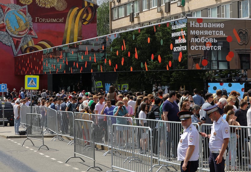 Scores of people queued outside what was formerly McDonald's flagship restaurant in Pushkin Square, central Moscow on Sunday. The outlet sported a new logo - a stylised burger with two fries - plus a slogan reading: 'The name changes, love stays'. Reuters