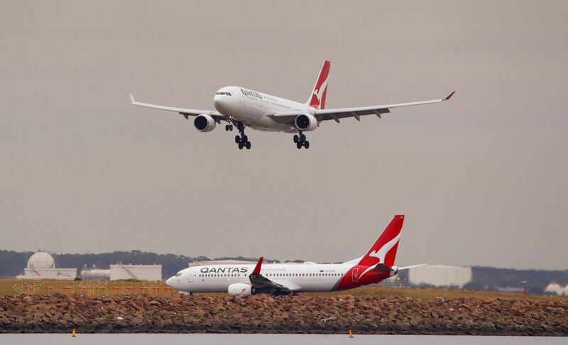 FILE PHOTO: A Qantas plane lands at Kingsford Smith International Airport in Sydney, Australia, February 22, 2018. REUTERS/Daniel Munoz/File Photo                        GLOBAL BUSINESS WEEK AHEAD