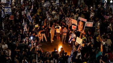 Protesters lit torches during a demonstration calling for a hostage deal with Hamas, on May 4, in Tel Aviv. Getty Images