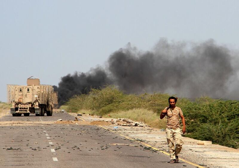 Yemeni loyalist forces patrol a main road near Mokha on January 20, 2017. Saleh Al Obeidi / AFP

