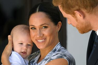 Britain's Prince Harry and his wife Meghan, Duchess of Sussex, holding their son Archie. Reuters