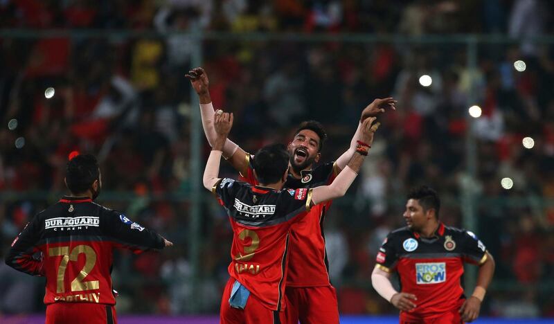 Royal Challengers Bangalore's Mohammed Siraj, second right, celebrates with teammates their win over Sunrisers Hyderabad in the VIVO IPL Twenty20 cricket match in Bangalore, India, Thursday, May 17, 2018. Royal Challengers Bangalore won the match by 14 runs. (AP Photo/Aijaz Rahi)