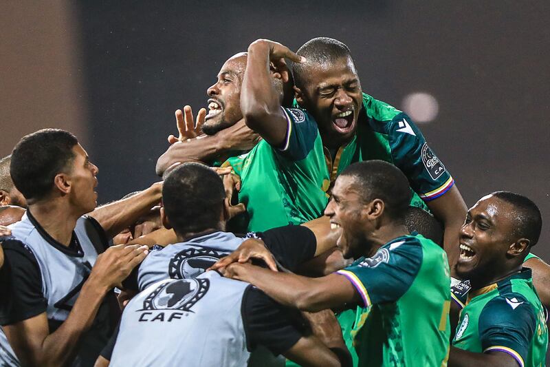 Comoros forward Ahmed Mogni celebrates with teammates after scoring his team's second goal . AFP