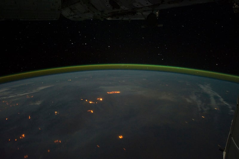 8.	Astronauts on the space station captured images of auroras australis, or southern lights, while flying over the Indian Ocean. Light created by the wildfires in Australia can also be seen. Photo: Nasa Earth Observatory