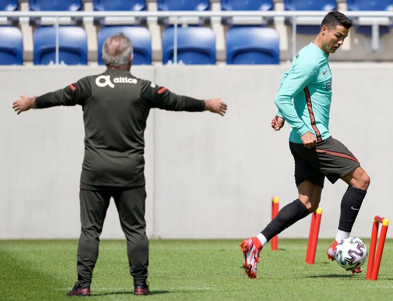 Cristiano Ronaldo goes through a drill during a training session at Illovszky Rudolf Stadium. EPA