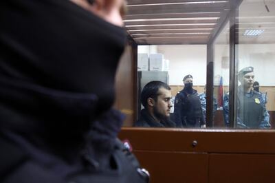One of the suspects in the Crocus City Hall attack waits for his pre-trial detention hearing in Moscow on Monday. AFP