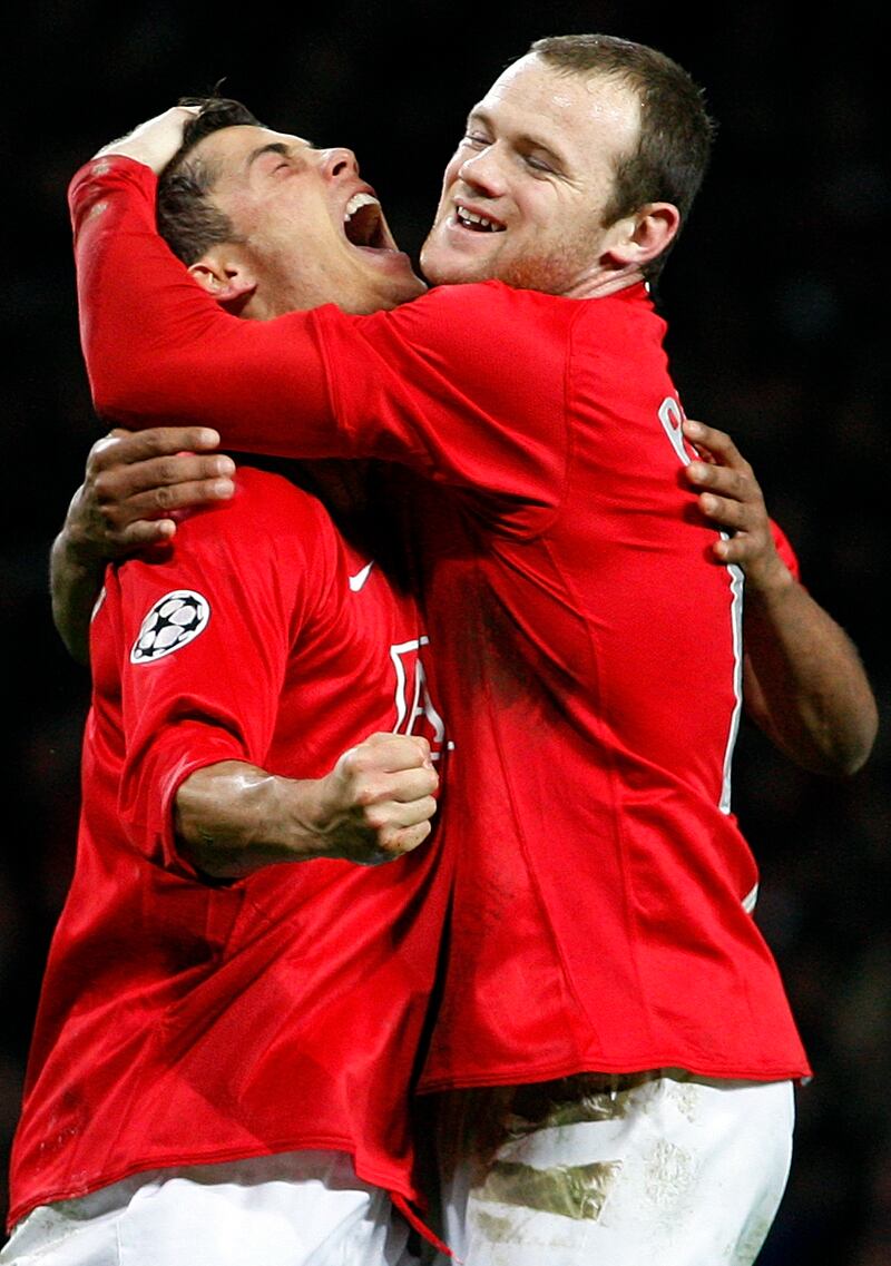 Manchester United's Cristiano Ronaldo celebrates his goal with teammate Wayne Rooney against Lyon during their Champions League match at Old Trafford on March 4, 2008. AP