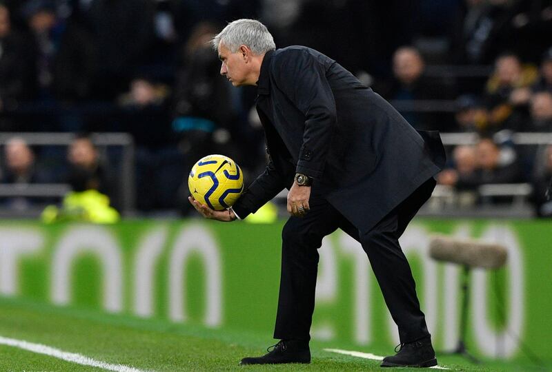 Jose Mourinho retrieves  the ball during the match against Bournemouth. EPA