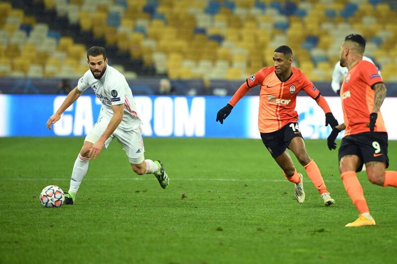 Shakhtar Donetsk forward Tete tracks Real Madrid defender Nacho Fernandez. AFP