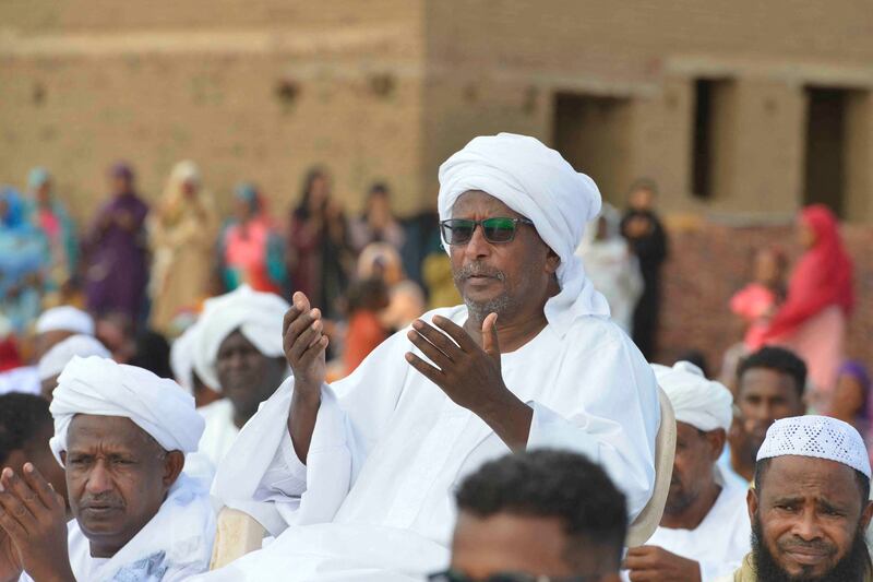 Sudanese worshippers who fled violence in Khartoum, gather for Eid Al Adha morning prayers in the region of Jazira, south of Khartoum. AFP