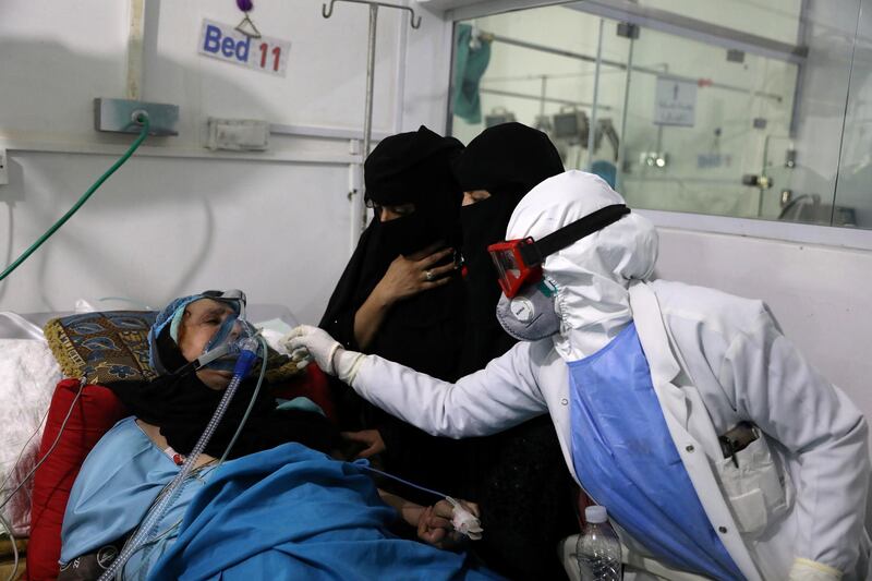 Women watch as a nurse tends to their relative who is being treated at an intensive care unit of a hospital  in Sanaa, Yemen. Reuters