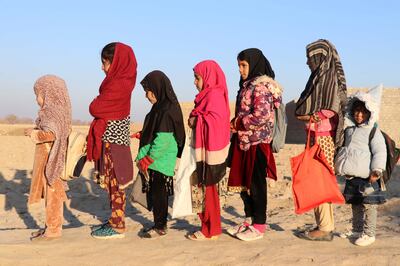 Afghan children arrive to attend their last class at an educational facility before its closure following a ban by the Taliban on women working for NGOs. Kandahar, Afghanistan, January 1, 2023. EPA / STRINGER