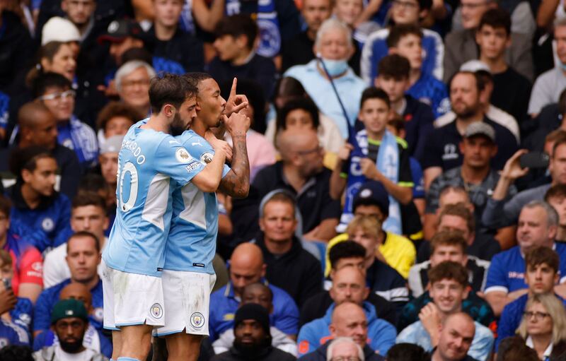 Manchester City's Gabriel Jesus celebrates with Bernardo Silva after scoring. Reuters