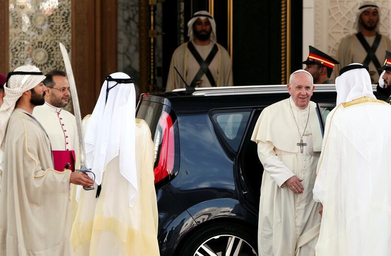 Pope Francis is welcomed as he exits the Kia.