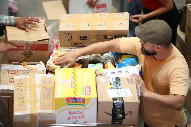 Volunteers packing aid boxes in Al Quoz, Dubai, for survivors of the earthquake