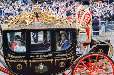 Britain's young Princess Charlotte and her mother Catherine, the Princess of Wales in a carriage ride after the coronation. AFP 