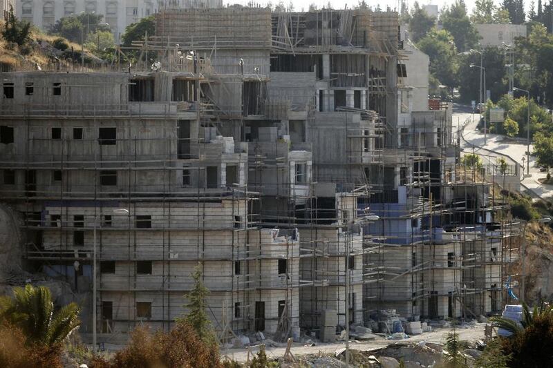 Buildings under construction in the Kiryat Arba Jewish settlement on the outskirts of Hebron.  Hazem Bader / AFP