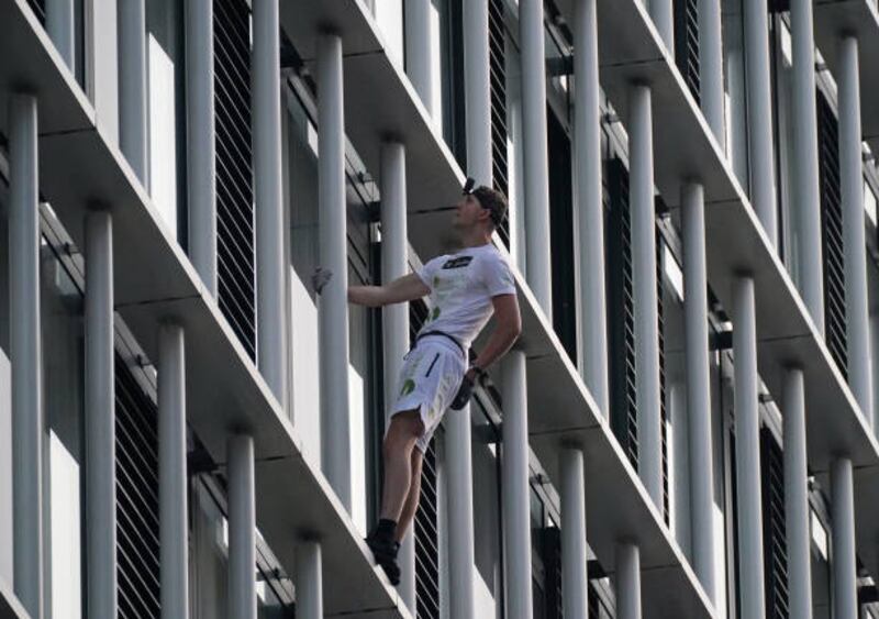 Free-solo climber George King ascends Stratosphere Tower in Stratford, east London. Getty