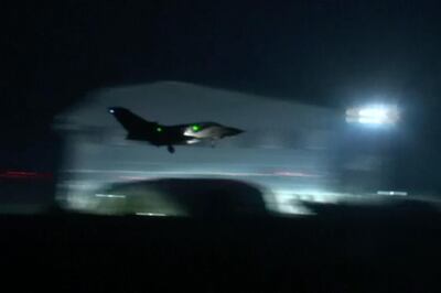 This image made from video shows a fighter jet landing at Akrotiri military British Royal Air Force Base, Cyprus, Saturday, April 14, 2018.  Fighter jets were seen taking off from a British Royal Air Force (RAF) base in Cyprus early on Saturday morning. Their destination was not revealed. The jets landed to Akrotiri Military Base, Cyprus, after the US President Donald Trump's announcement that the US, France and Britain together launched military strikes in Syria to punish President Bashar Assad for his alleged use of chemical weapons against civilians and to deter him from doing it again.(AP Video)