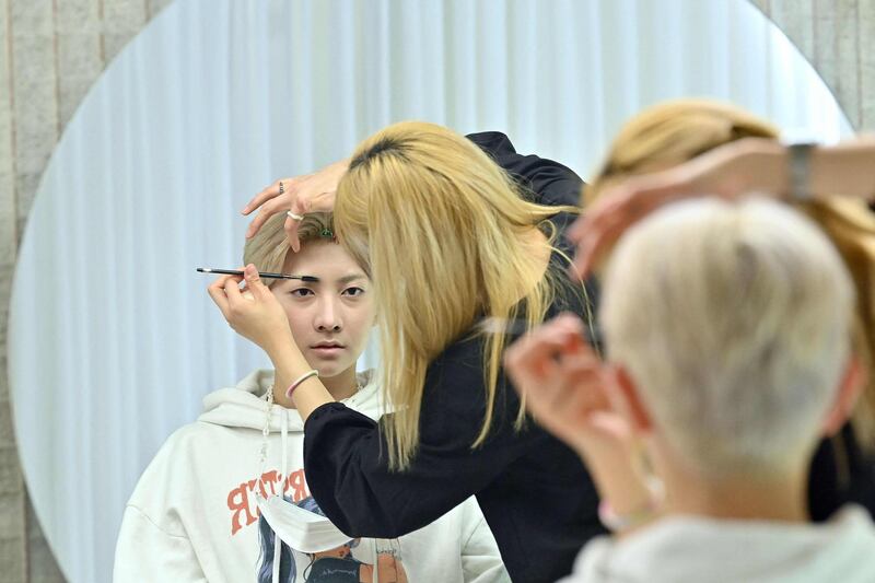 Blitzers member Lee Jun-young having his make-up done at a beauty salon in Seoul ahead of a promotional shoot. AFP