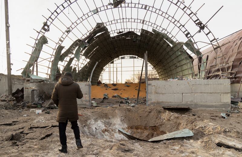 A damaged hangar used to store grain after an overnight rocket attack in Pisochyn, north-eastern Ukraine. No one was killed or injured. EPA