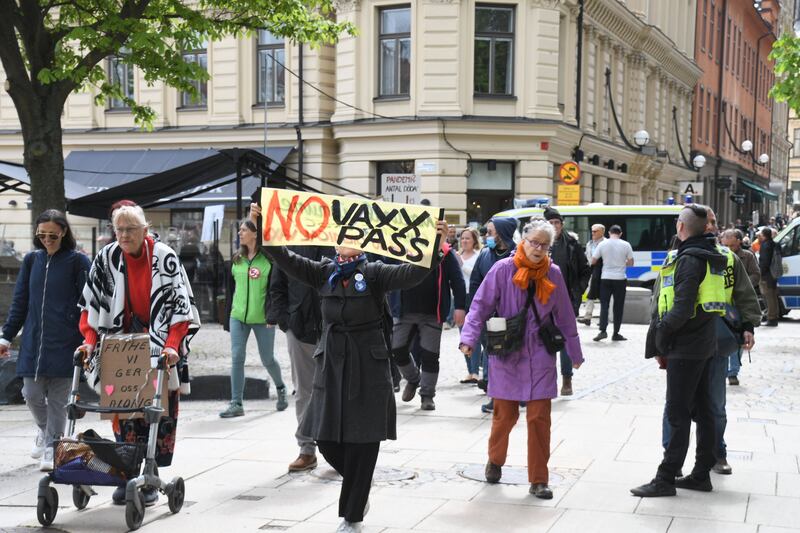 People gather to stage a demonstration to protest against Covid-19 restrictions in Stockholm, Sweden. Getty Images