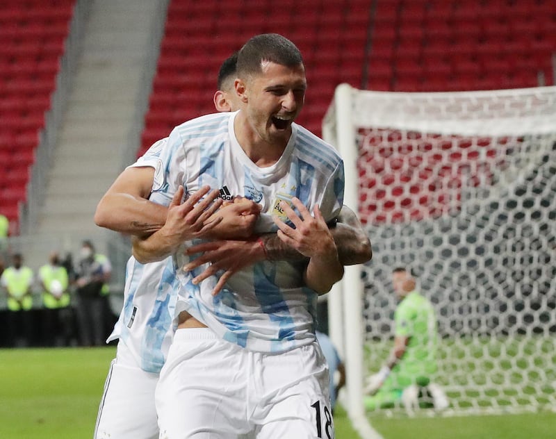Argentina's Guido Rodriguez celebrates scoring their goal with Cristian Romero. Reuters