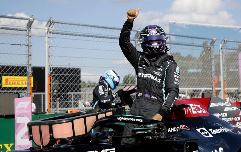 Mercedes driver Lewis Hamilton celebrates after he clocked the fastest time during the qualifying session for the Hungarian Grand Prix. AP