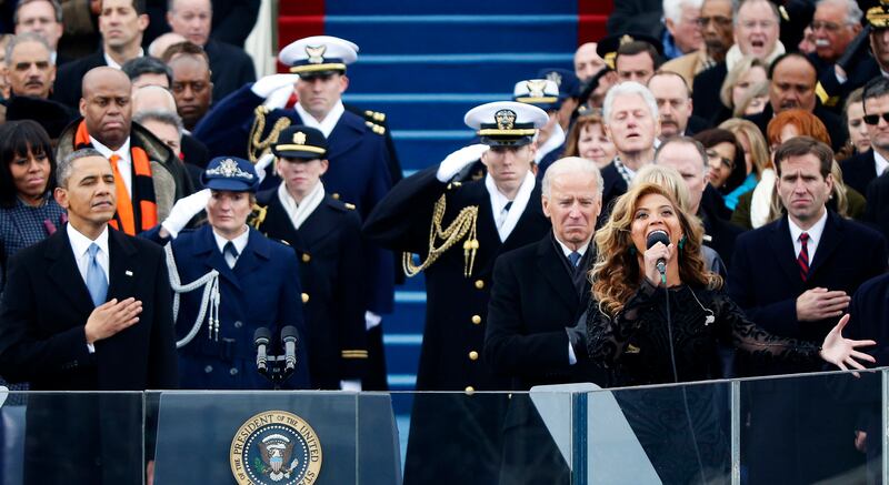 Beyonce sings the national anthem as US President Barack Obama and Vice President Joe Biden look on during the swearing-in ceremonies on the West Front of the US Capitol in Washington, January 21, 2013. Reuters
