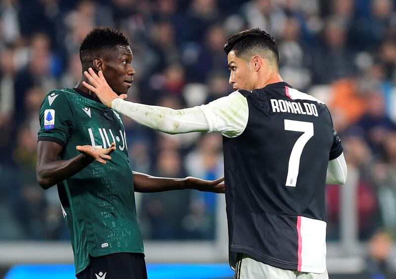 Soccer Football - Serie A - Juventus v Bologna - Allianz Stadium, Turin, Italy Juventus' Cristiano Ronaldo and Bologna's Ibrahima Mbaye clash. REUTERS