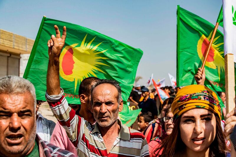 Syrian Kurds take part in a demonstration against threats by Turkish threats in the town of Ras Al Ain in Syria's Hasakeh province near the Turkish border. Ankara had reiterated on October 5 an oft-repeated threat to launch an "air and ground" operation in Syria against a Kurdish militia it deems a terrorist group. AFP
