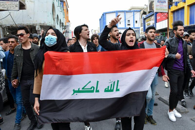 Iraqi students take part in an anti-government march calling for an overhaul of the political system and a non-controversial prime minister, in the southern Iraqi city of Nasiriyah on february 16, 2020. - While Iraq's premier-designate Mohammad Allawi promised on February 15 to form a cabinet stacked with "independents", demonstrators still consider him too close to the political elite that has governed Iraq since the 2003 US-led invasion and that they want to see gone. (Photo by Asaad NIAZI / AFP)