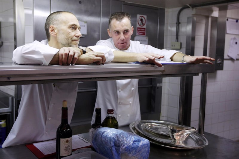 LONDON, ENGLAND - APRIL 06:  Celebrity chefs Michel Roux Jr (L) and Gary Rhodes observe chefs preparing a meal of Brill Cherubin as they compete in the final round to win a 'Roux Scholarship' at the Mandarin Oriental Hyde Park on April 6, 2009 in London, England. The prize for being awarded a Roux Scholarship is, among other things, a cheque for GBP 5,000 plus up to three month's training at a 3-star Michelin restaurant in Europe.  (Photo by Oli Scarff/Getty Images)