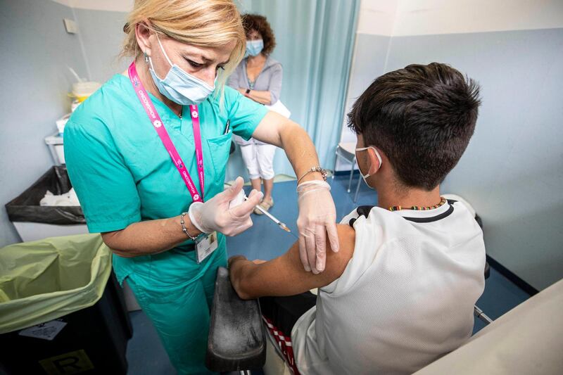 A boy receives a vaccine in Rieti, Italy, on a day dedicated to vaccinations for children aged between 12 and 16. EPA